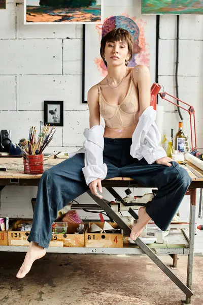A woman in a peaceful pose on top of a wooden table. — Stock Photo