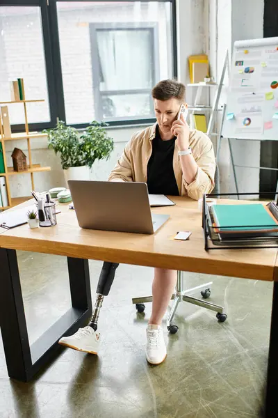 Businessman engrossed in work on a laptop at his desk. — Stock Photo