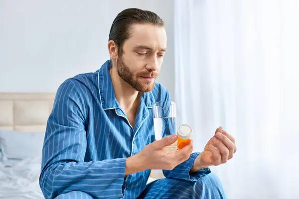 A stylish man taking pills. — Stock Photo
