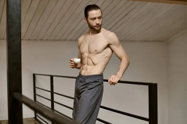Shirtless man enjoying a cup of coffee at home. — Stock Photo
