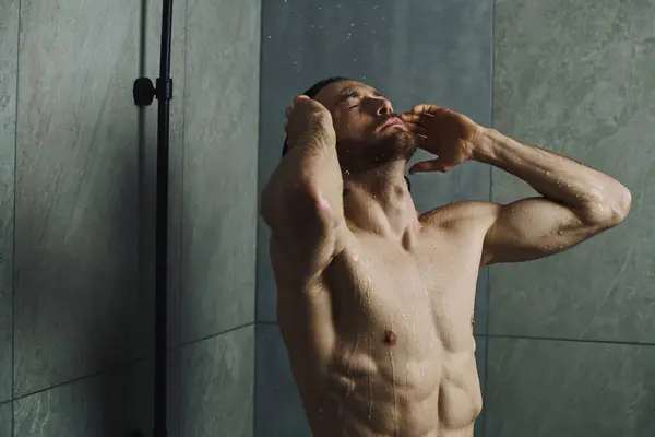 Man taking a shower during morning routine. — Stock Photo