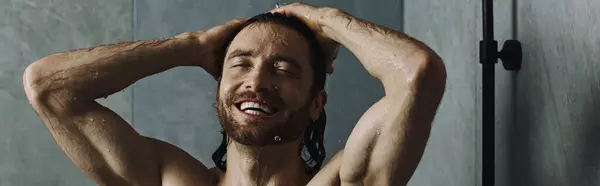 Handsome man taking a shower, starting his day with self-care routine. — Stock Photo