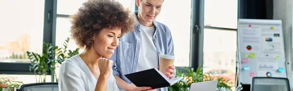 Diverse women analyze data on a computer screen in an office setting. — Stock Photo