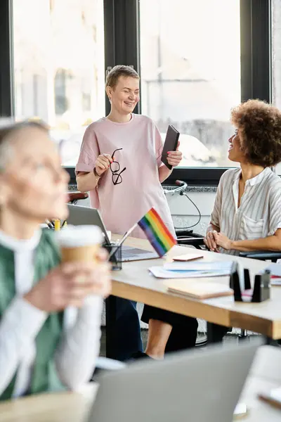 Hard-working, diverse group of businesswomen and LGBT individuals collaborating in a coworking space. — Stock Photo