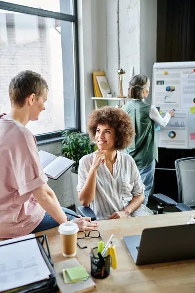 Joyful diverse female professionals working together on their project in office. — Stock Photo