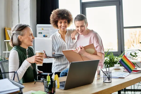 Enthusiastic diverse female professionals talking about their project in office. — Stock Photo