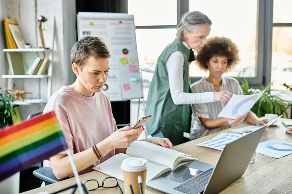 Committed diverse businesswomen, including members of the LGBT community, working together in an office. — Stock Photo