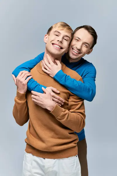 Two men hugging and smiling joyfully. — Stock Photo