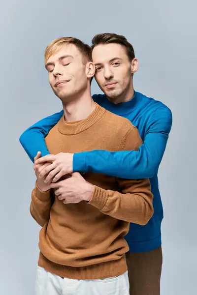 Two men hugging with closed eyes — Stock Photo
