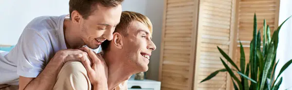 A man carries his partner on his back in a tender moment of togetherness. — Stock Photo
