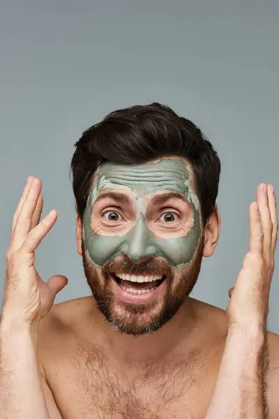 Man with a facial mask on white backdrop. — Stock Photo