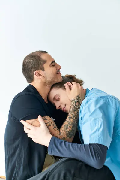 A tender moment between two men hugging each other. — Stock Photo
