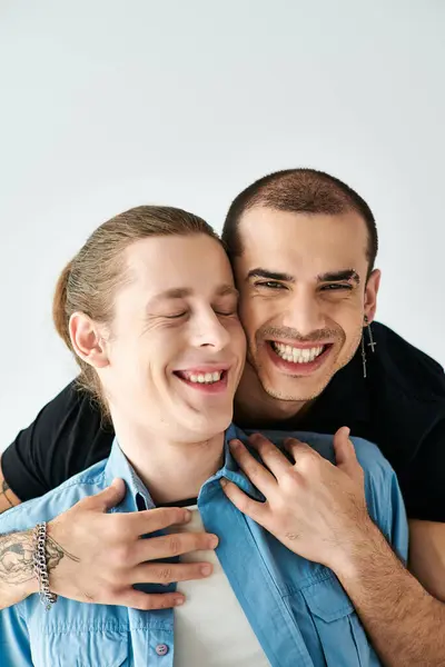 Two men share a warm embrace, expressing love and connection. — Stock Photo