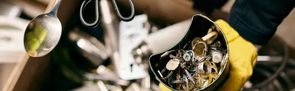Pair of yellow gloves hang gracefully from a wall, embodying the eco-conscious efforts of a young volunteer sorting waste. — Stockfoto