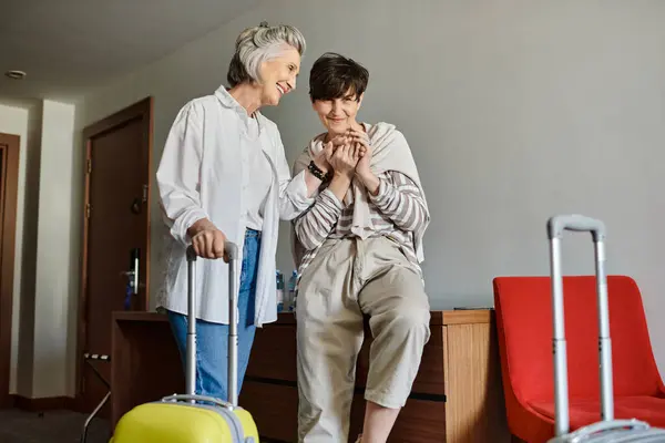 A loving tender senior lesbian couple standing together. — Stock Photo