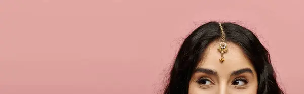 Young indian woman with long hair adorned with a tiara, exuding confidence and beauty. — Stock Photo