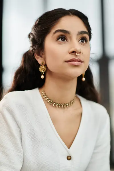 A young indian woman proudly showcases her necklace and earrings. — Stock Photo