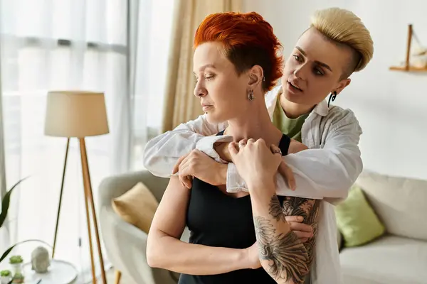 Lesbian woman calming down her offended partner at home — Stock Photo