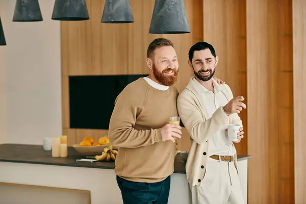 Two men with beards laughing in a cozy kitchen, enjoying each others company and creating memories. — Stock Photo