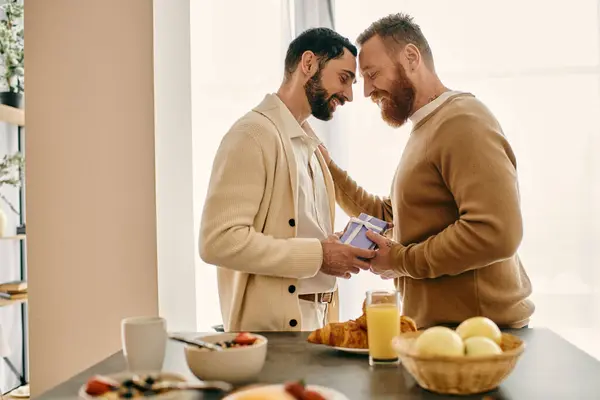 Two bearded men stand in a kitchen, sharing a moment of bliss and connection in their modern apartment. — Stock Photo