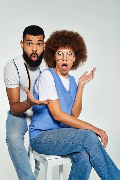 African American friends in stylish clothes, showcasing friendship and equality on a grey background. — Stock Photo