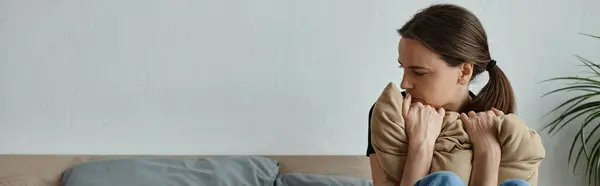 Middle-aged woman with hands on face in deep thought. — стокове фото