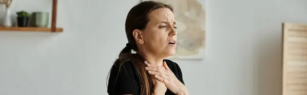 Middle-aged woman finding solace with hands on chest. — Stock Photo