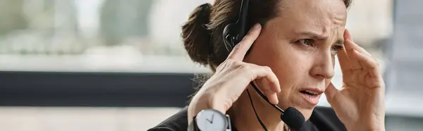 Middle-aged woman experiencing stress relief with a headset on her head. — Stockfoto