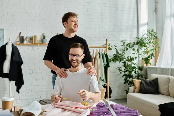 Two men collaborate on a stylish project in their designer workshop. — Stock Photo