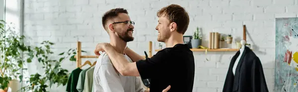 Two men in a designer workshop, crafting fashionable attire with a touch of love and creativity. — Stock Photo