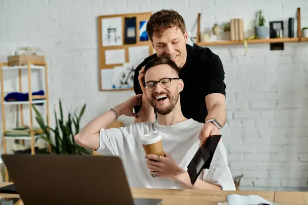 A man lovingly helps his partner style his hair in a designer workshop. — Stock Photo