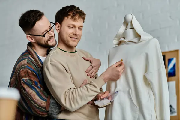 Two men, creators in a designer workshop, stand side by side in artistic collaboration. — Stock Photo