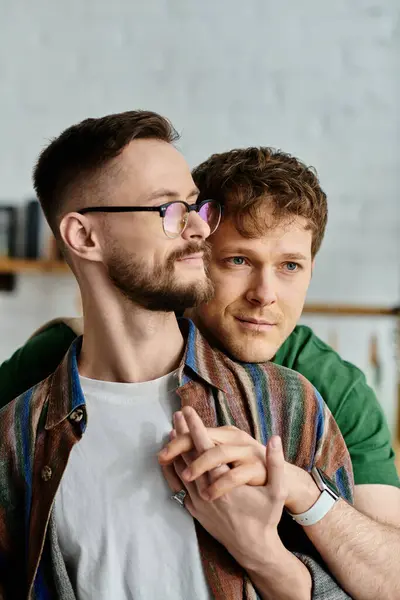 Two men, a gay couple, collaborate in a designer workshop to create trendy, unique attire. — Stock Photo