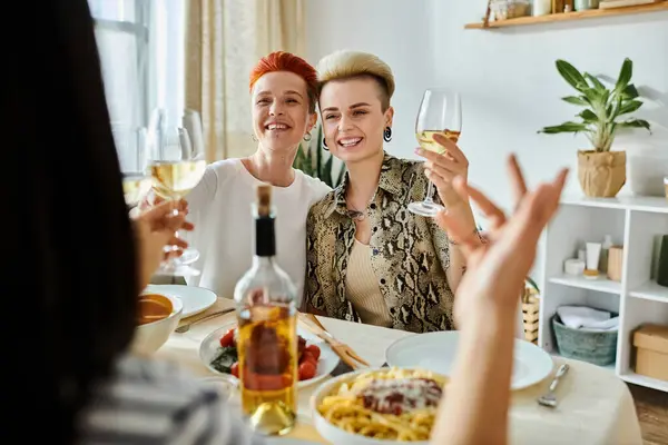 Diverse group enjoys wine together. — Stock Photo