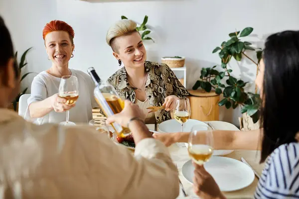 A group of women of various ethnicities enjoying wine at a table. — Stock Photo