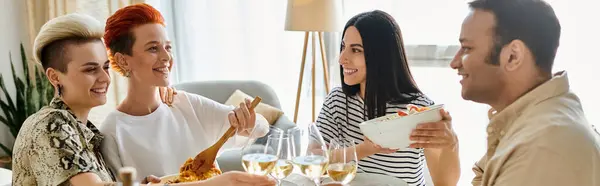 A diverse group of friends, including a loving lesbian couple, enjoy wine around a table. — Stock Photo