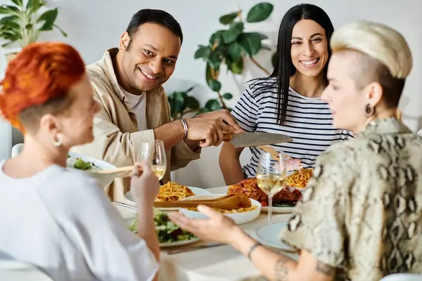 Diverse group enjoying meal at table - lesbian couple included. — Stock Photo