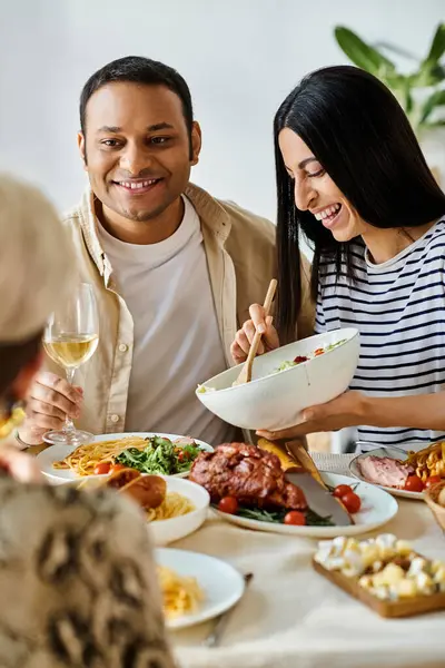 Diverse group enjoying dinner together at home. — Stock Photo