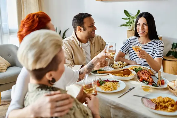 Diverse friends and a loving lesbian couple enjoying a meal together at a table. — Stock Photo