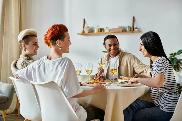 Diverse group of friends enjoying wine at a dinner table. — Stock Photo