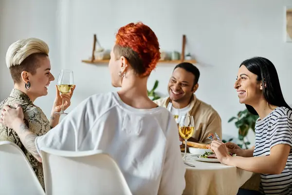 Diverse group enjoys wine and conversation around table. — Stock Photo