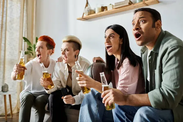 Diverse group enjoying drinks on couch. — Stock Photo