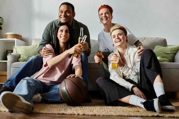 Diverse friends, including a loving lesbian couple, sit closely on top of a cozy couch. — Stock Photo