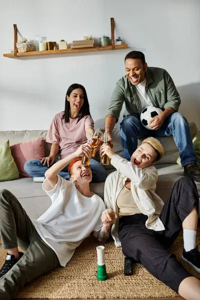 Diverse group of friends, including a loving lesbian couple, sitting together on top of a couch. — Stock Photo