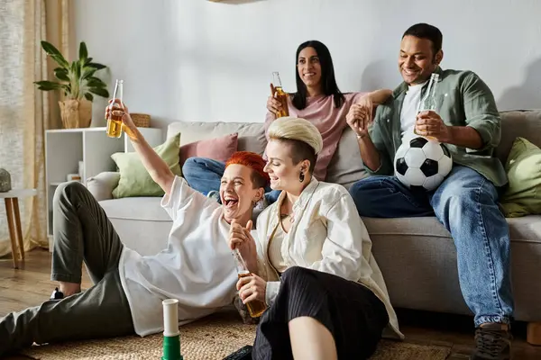 Multicultural friends relax together on sofa. — Stock Photo