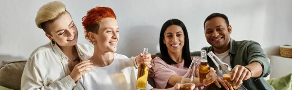 Diverse group enjoying drinks and conversation around a table. — Stock Photo