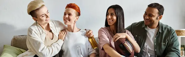 Diverse group sitting closely together on a couch, enjoying each others company. — Stock Photo