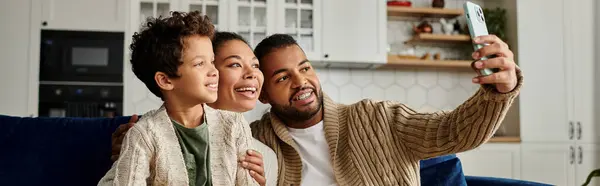 African American man taking selfie with loving family at home. — Stock Photo