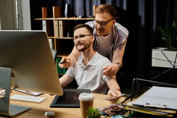 Two men in office attire engaging with a computer screen. — Stock Photo