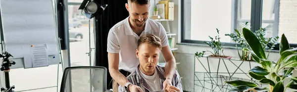 Two loving men working together in a modern office setting. — Stock Photo